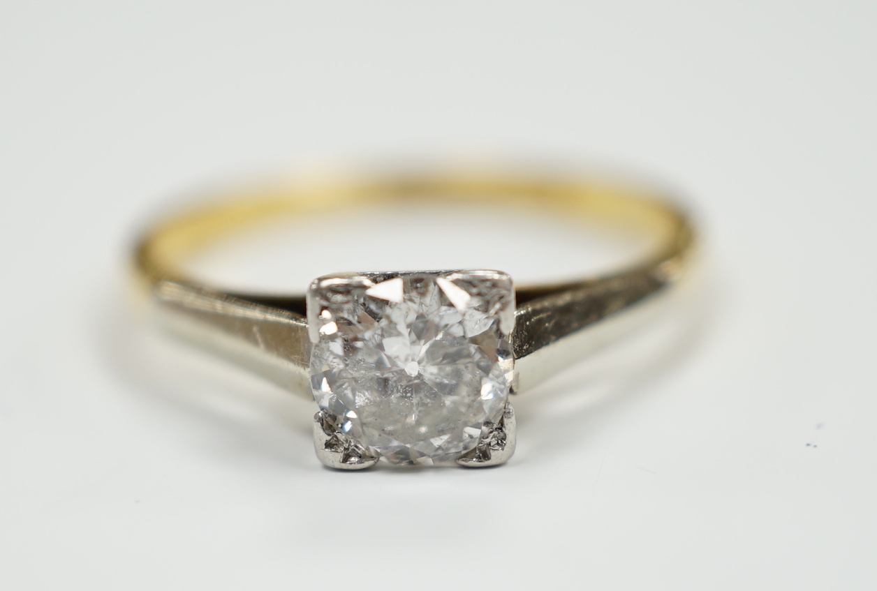 An 18ct, plat. and solitaire diamond ring, size O, gross weight 2.7 grams, the stone measuring 5.7mm in diameter.